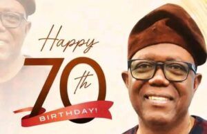 Barr Akeem Agbaje Celebrates Former Oyo Speaker Dr. Onigbinde (SAN) At 70 Smiling man in glasses and a brown cap beside a 'Happy 70th Birthday' banner honoring Rt. Hon. Dr. Akin Onigbinde (SAN).