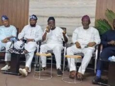 Guber 2027: Five Aspirants Call For Oyo APC Chairman’s Resignation Five men seated in a row at a conference, one speaking into a microphone while others listen, in traditional outfits with neutral backdrop.