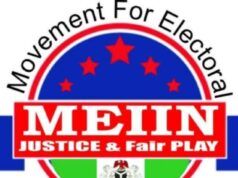 MEIIN Celebrates Democracy Day, Praises Tinubu’s Role In Nigeria’s Democratic Struggle Logo for Movement For Electoral Integrity In Nigeria (MEIN): circular emblem with a red banner reading 'JUSTICE & FAIR PLAY', blue field with red stars, and Nigerian flag colors around the edge.