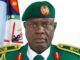 Nigeria-U.S. Partnership Has Weakened ISIS Operations – DHQ Portrait of a green-uniformed military officer with a beret, ribbons, and medals, standing before a flag backdrop.