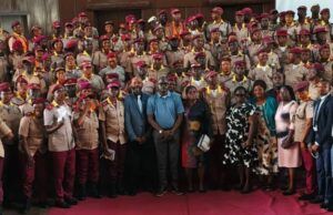 OYRTMA Trains Officers On Public Safety, Intelligence Gathering Large group of uniformed officers with red berets posing for a formal group photo, civilians in front on a red carpet.