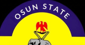 Police Arrest 3 Suspected Cultists, Political Thugs In Osun, Recover Weapons Logo of Osun State Police Command, featuring Nigeria Police emblem with a yellow center and purple top band, green bottom band, and an elephant with a red crest above a blue banner reading 'The Nigeria Police'.