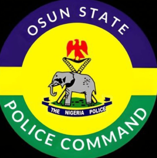 Osun Police Logo of Osun State Police Command, featuring Nigeria Police emblem with a yellow center and purple top band, green bottom band, and an elephant with a red crest above a blue banner reading 'The Nigeria Police'.