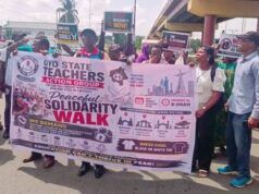 Oyo School Abduction: NANS Urges Caution Over Call For Strike As Crisis Deepens Group of protesters holding a banner for a peaceful solidarity walk organized by the Oyo State Teachers Action Group in Nigeria.