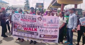 Oyo School Abduction: NANS Urges Caution Over Call For Strike As Crisis Deepens Group of protesters holding a banner for a peaceful solidarity walk organized by the Oyo State Teachers Action Group in Nigeria.