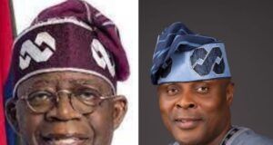 APC Support Groups Council Endorses Tinubu For Second Term On Democracy Day Two Nigerian men in traditional attire posing side by side: the left is an older man with a purple cap and glasses, the right is a younger man in a blue agbada with a matching patterned cap, both smiling.