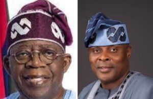 APC Support Groups Council Endorses Tinubu For Second Term On Democracy Day Two Nigerian men in traditional attire posing side by side: the left is an older man with a purple cap and glasses, the right is a younger man in a blue agbada with a matching patterned cap, both smiling.