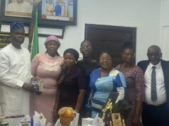 Oyo Govt Backs Women Broadcasters’ Forum, Declares 3-Day Prayer/Fasting For Orire Abductees Group of professionals posing for a photo at an awards ceremony with trophies and certificates on the table in front of them.