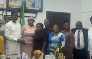 Oyo Govt Backs Women Broadcasters’ Forum, Declares 3-Day Prayer/Fasting For Orire Abductees Group of professionals posing for a photo at an awards ceremony with trophies and certificates on the table in front of them.