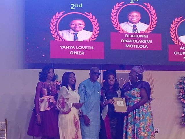 Oladunni Oladunni Obafolakemi Motilola, with her proud parents and others at the valedictory service...