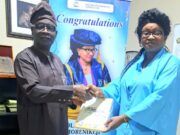 Kola Daisi ‘Varsity’s New VC, Prof Morenikeji Receives Copy Of ParrotXtra’s 20th Anniversary Compendium Professor Olajumoke Morenikeji, right, receives the Compendium from Ambassador Olayinka Agboola...in her office...