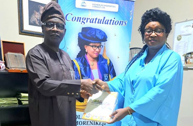 Prof Olajumoke Professor Olajumoke Morenikeji, right, receives the Compendium from Ambassador Olayinka Agboola...in her office...