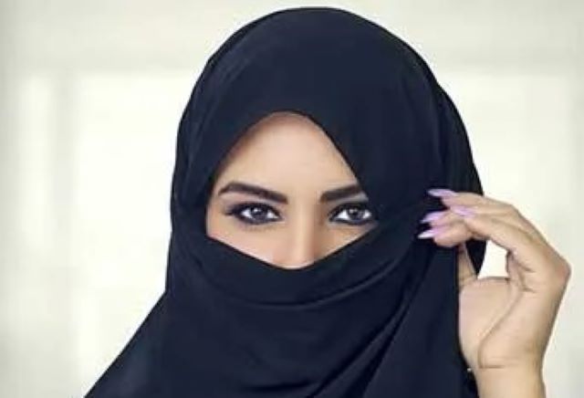 face covering ...a typical lady covering her face...this act in public places is now banned in Portugal...