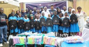 Excitement As Dangote Cement Boosts Learning In Lagos Host Community Group photograph of students and pupils of Ladi-Lak Nursery and Primary Schools and management team of Dangote Cement during the donation of the school items...